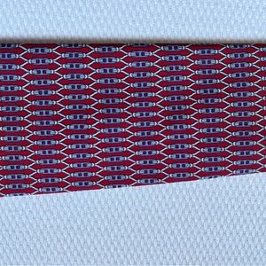 Preowned Hermes maroon patterned tie. Excellent condition.